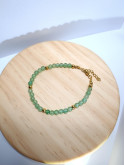 Bracelet en pierres naturelles d'aventurine et acier inoxydable doré