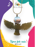 Collier artisanal chouette en laiton et sa perle de tableau bleue noire et bronze
