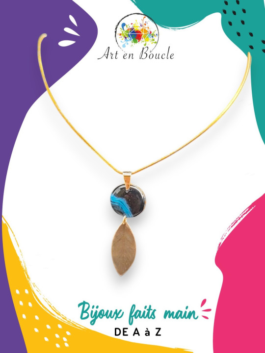 Collier plume artisanal en laiton et sa perle de tableau bleue noire